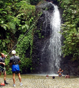 Canyoning through jungle waterfalls