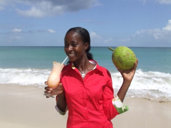 Susan Andrews with her winning cocktail and breadfruit: delicious drinks made of local vegetables.