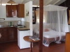 Nice beach cottages: double bed in one of the units (example)
