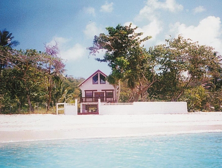 House on the beach seen from the sea