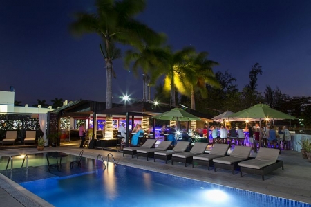 Pool deck and restaurant at dusk