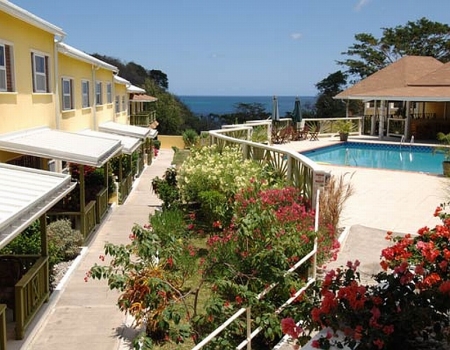 Grooms Beach Resort with a view over the pool